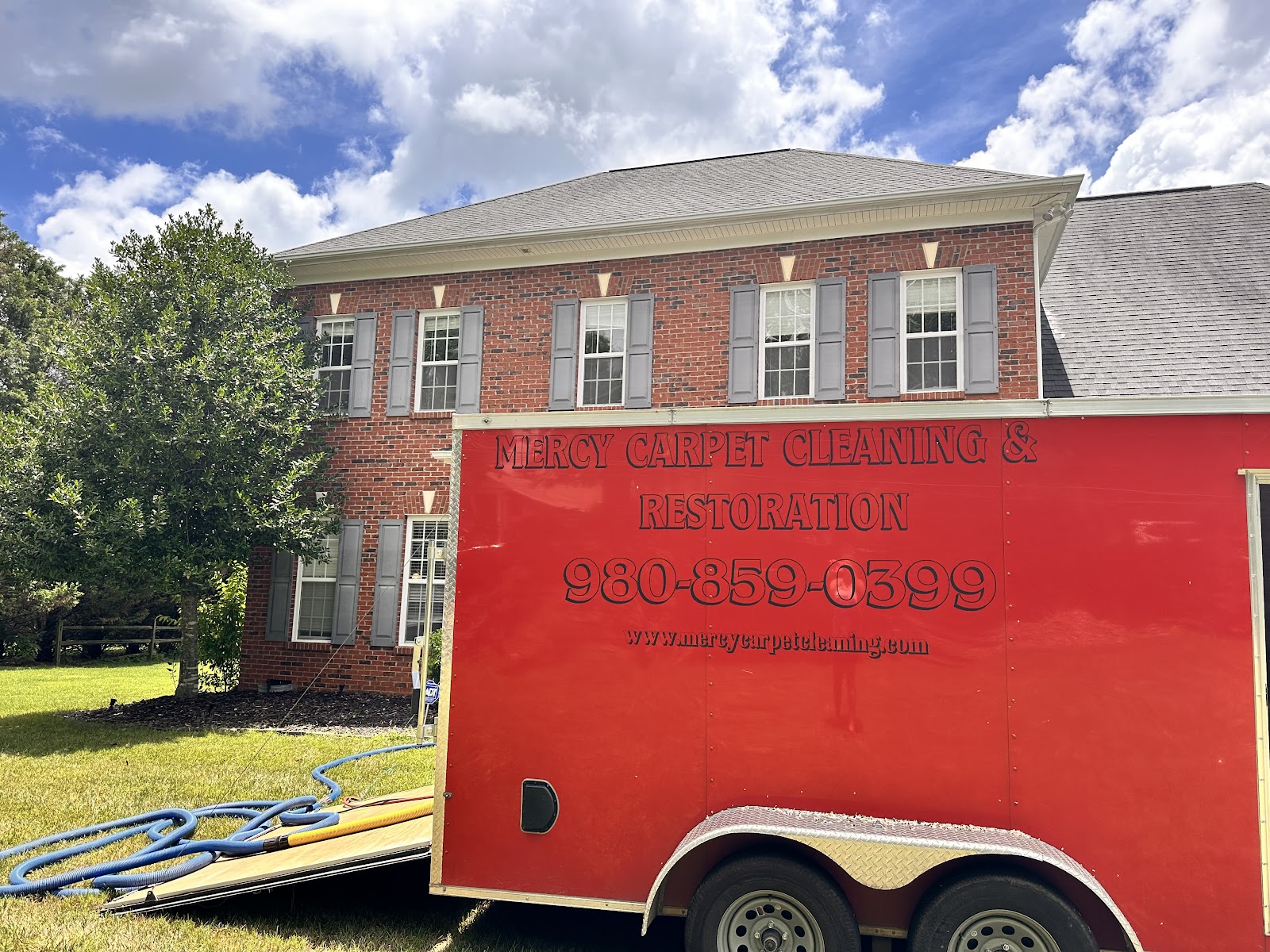 Truck-mounted hot water extraction cleaning in progress