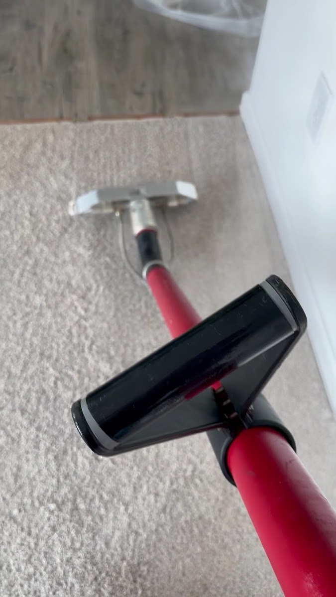 Truck-mount carpet cleaning wand on a residential carpet
